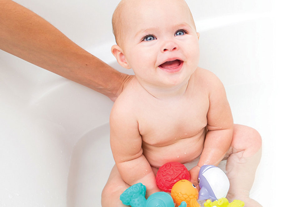 Non-Professional plays in baths with a toy